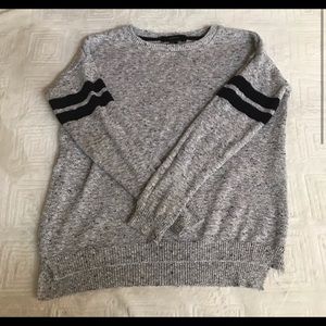 Grey sweater with black stripes on the sleeves